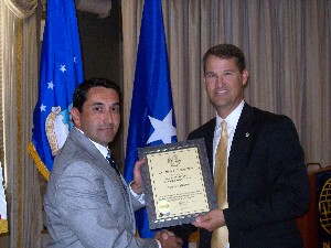 Mike Archuleta (l), BAE Systems Incorporated, accepts a corporate membership certificate from Marion in August.